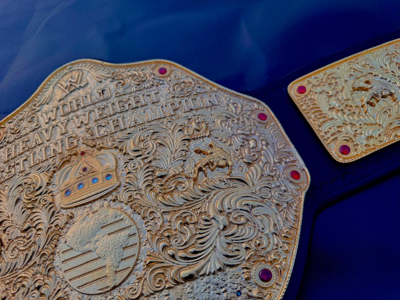 Premium CNC 3D Big Gold World Heavyweight Championship replica title belt featuring 24k gold plated plates and a high-quality leather strap.