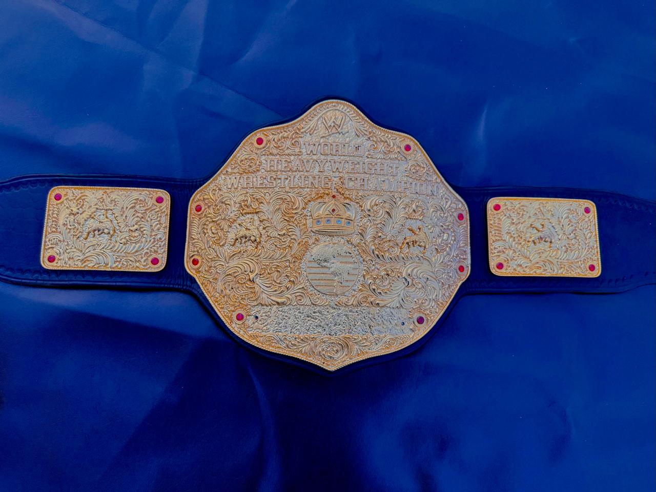 Premium CNC 3D Big Gold World Heavyweight Championship replica title belt featuring 24k gold plated plates and a high-quality leather strap.