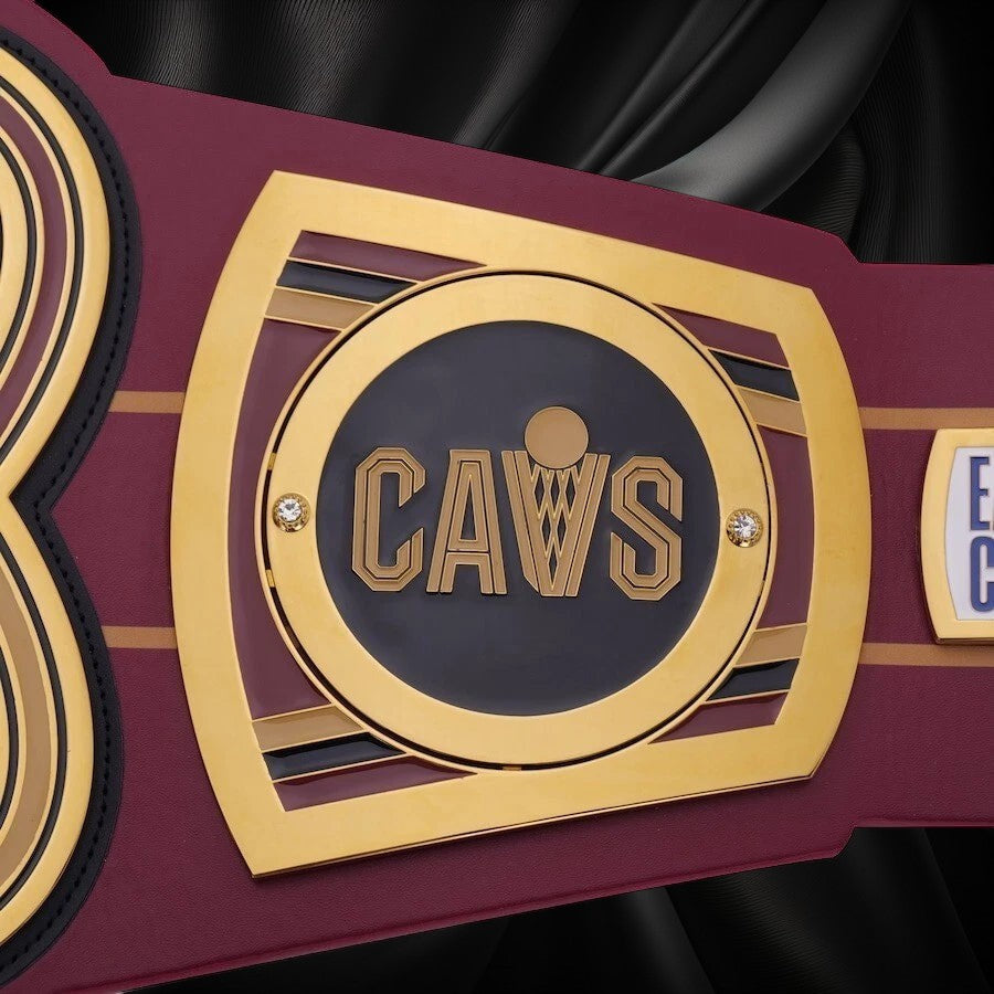 Championship belt with 'CAVS' logo on a white background