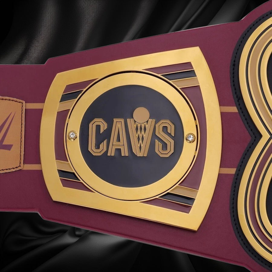 Maroon and gold championship belt with 'CAVS' logo on a white background
