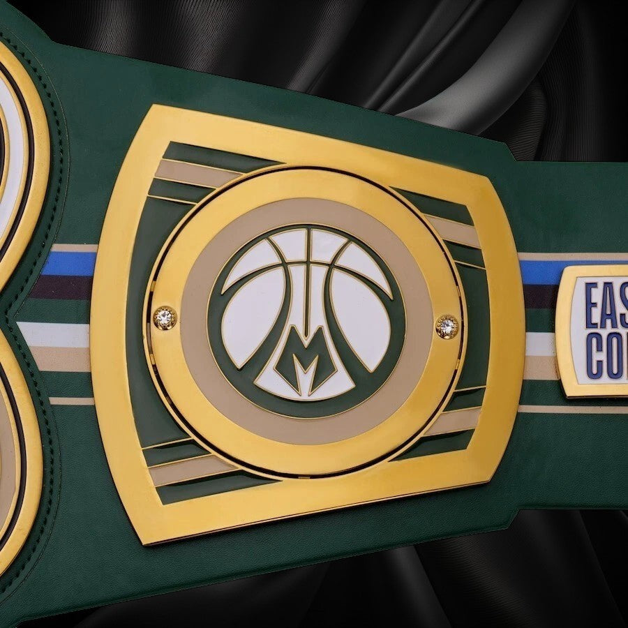 Green championship belt with gold and white emblem on a white background