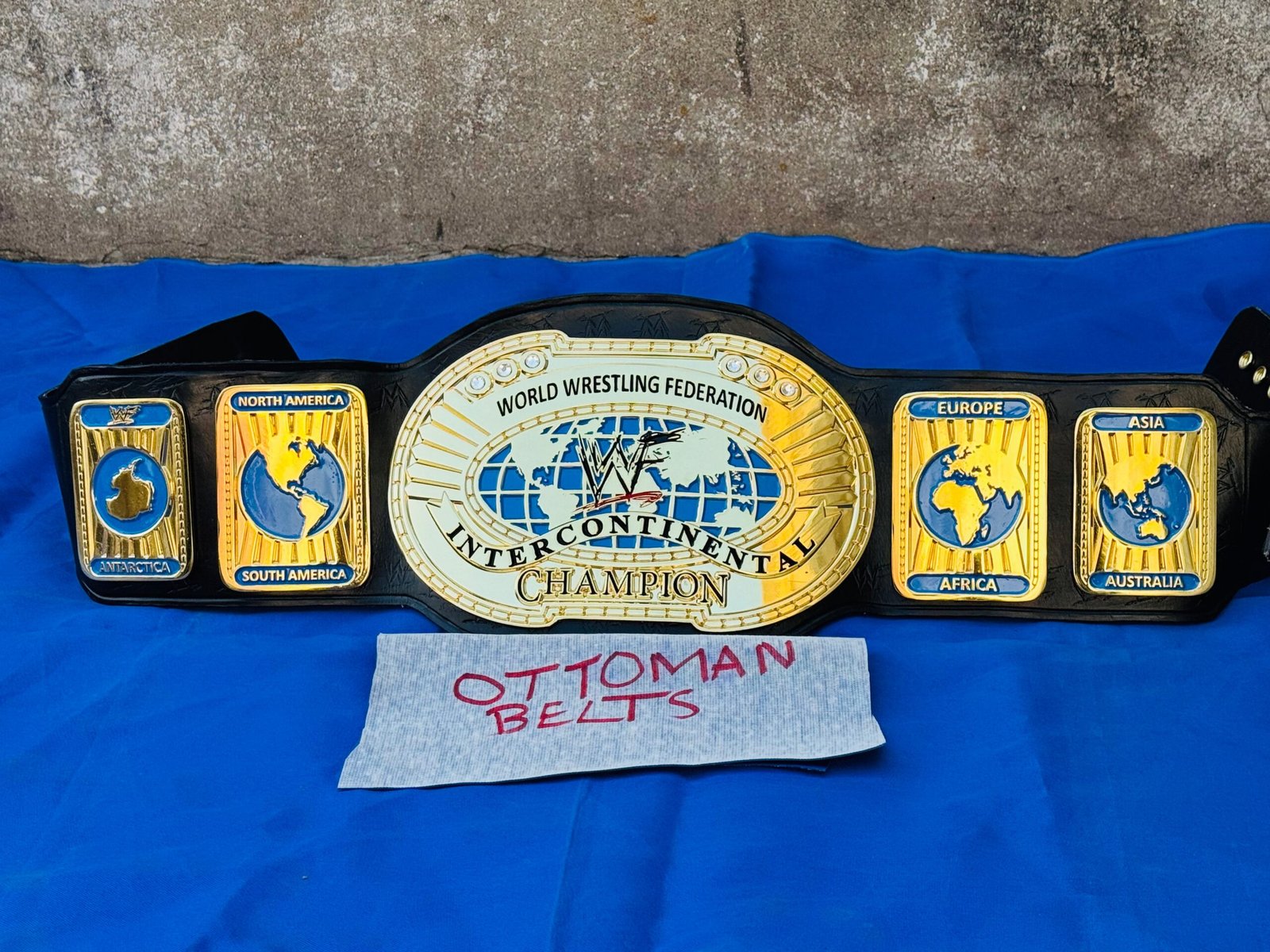 FullSizeRender_ca6810ec-d73e-4f9c-89ae-a315dcb3c63d WWF Intercontinental Championship Replica Belt 4mm Zinc 24kt Gold Adult size replica hand tooled original cowhide leather strap