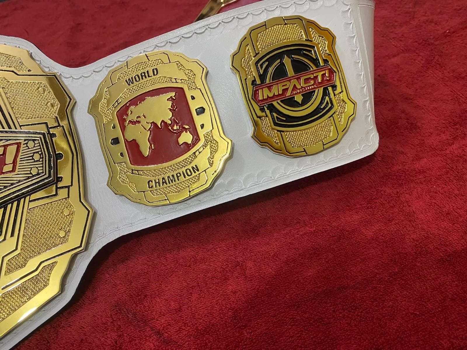 ad_5_0bc9d82a-58e3-44fd-aa63-7c50669044e5 TNA Impact World Heavyweight Wrestling Championship Title Belt | Custom 4MM Zinc Gold Plated | White Leather Strap | - Image 6