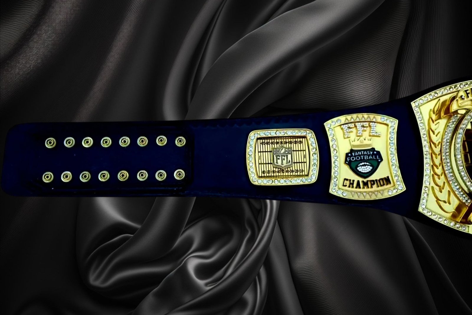 ottoman-belts-fantasy-football-championship-belt_ff776987-5a41-43af-bcd2-f527898ccd67 Ottoman Belts fantasy football championship belt with gold plates, crystal accents, and black strap on silk fabric.