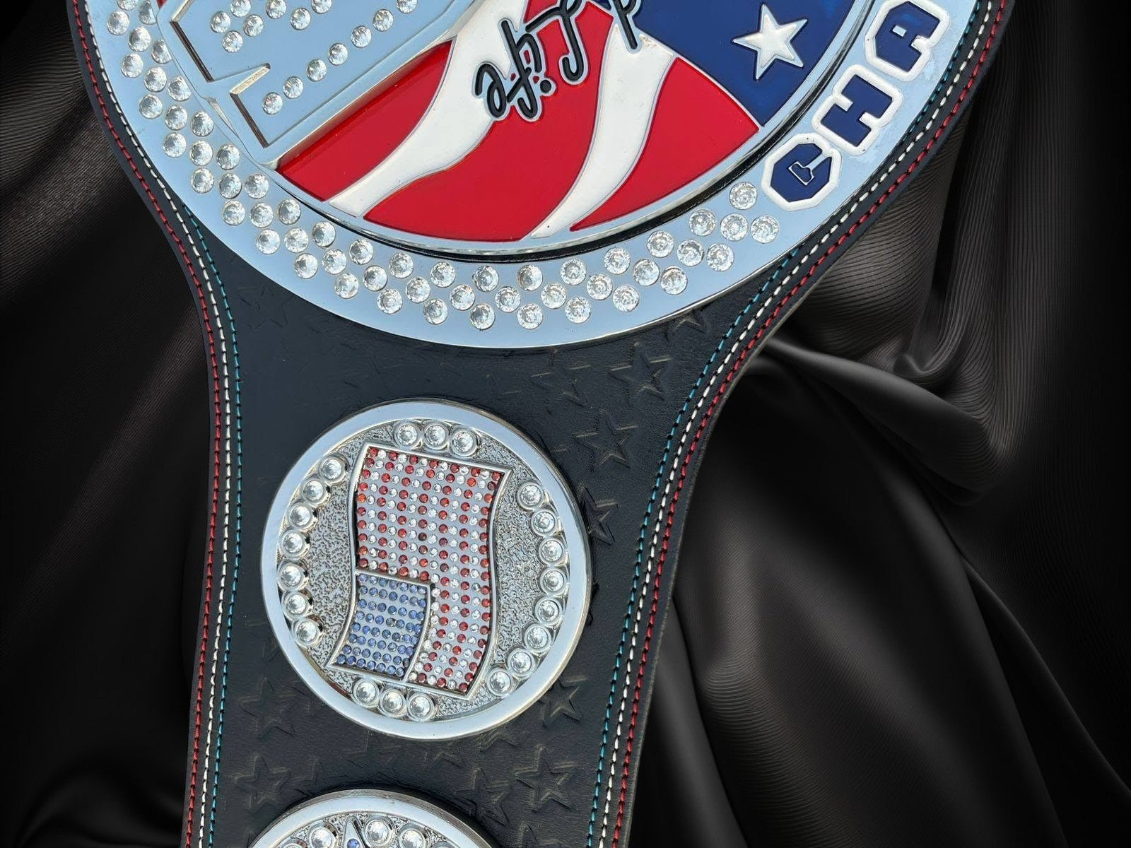 ottoman-belts-john-cena-spinner-belt_7e4b1a7c-939c-4581-b5cf-040572503d3a Ottoman Belts John Cena United States spinner replica belt with 4mm brass plates, cubic zirconia stones, and leather strap.